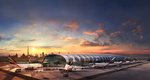 Hala A przeznaczona do obsługi Airbusów A380 podczas zachodu słońca. W tle panorama Dubaju. Terminal A zachód słońca.jpg
